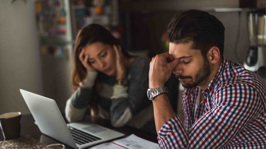 woman and man looking stressed