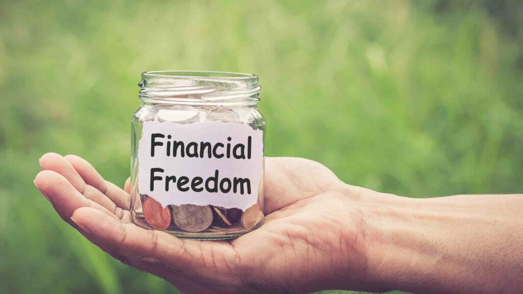 man holding financial freedom note